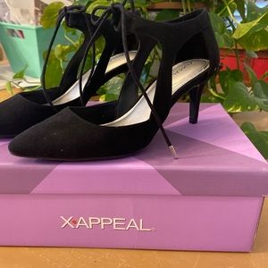 Black suede high heels.